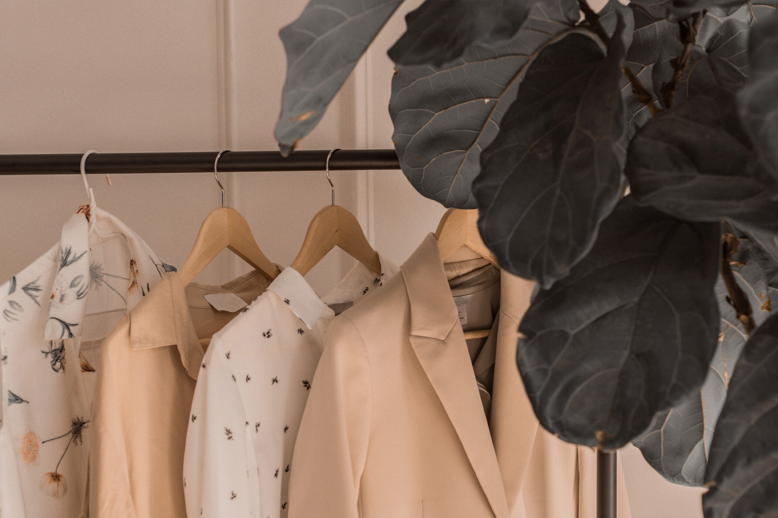 christian-clothing for woman and men hanging in wardrobe